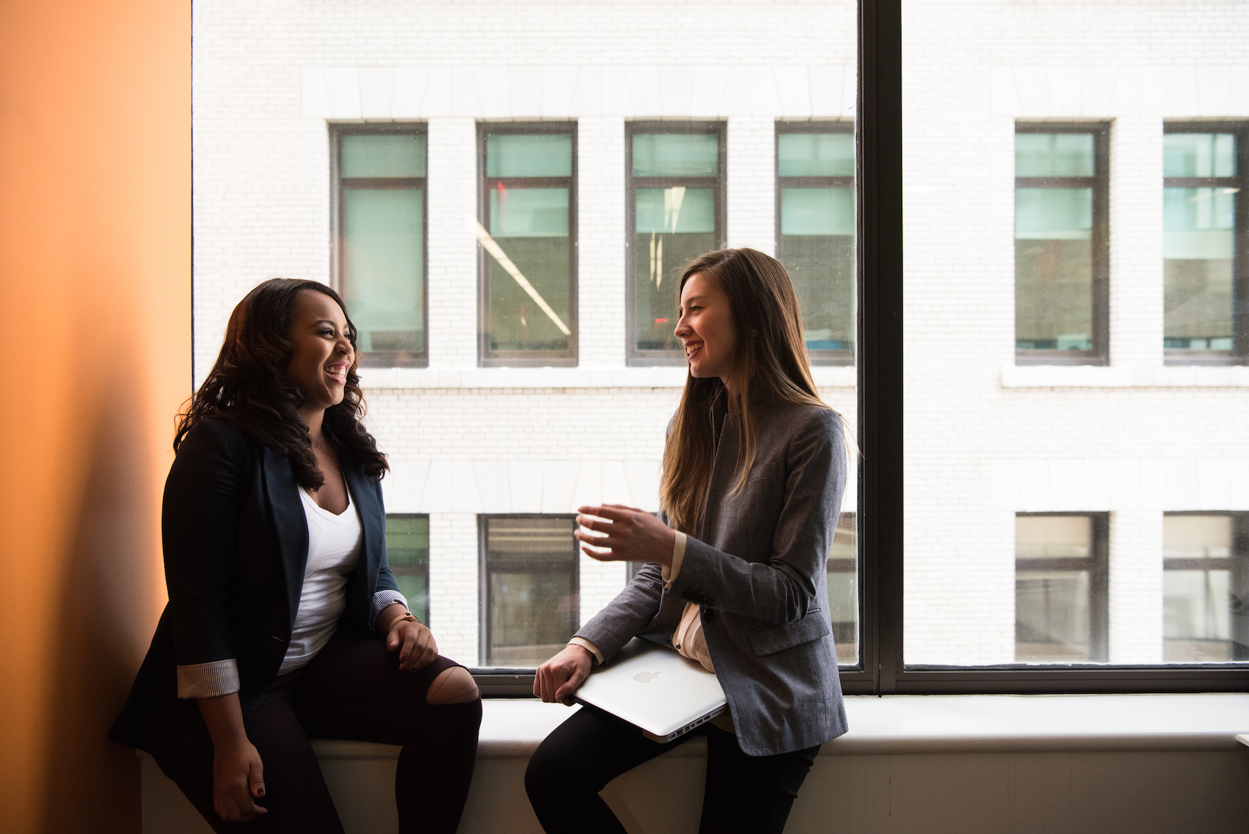 Women discussing real estate school in louisiana