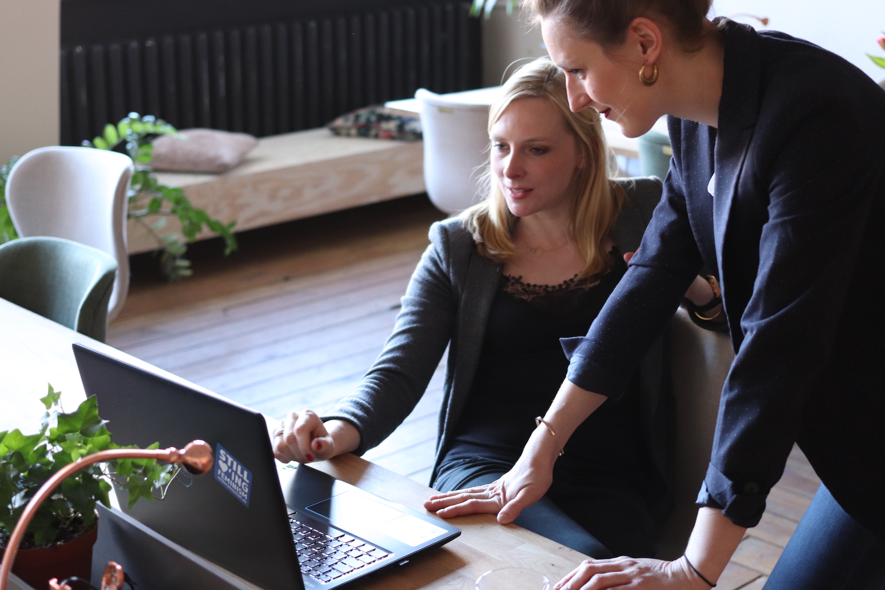 Real estate agents looking at computer together